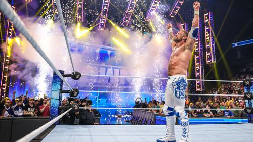 Un luchador se para en el ring rodeado de fuegos artificiales mientras Edge contempla su futuro desconocido.