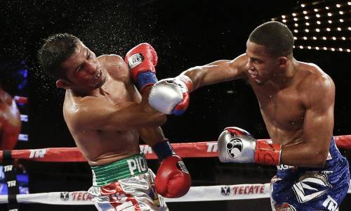 Felix Verdejo, right,of Puerto Rico, punches Juan Jose Martinez, of Mexico, during the fifth round of a WBO lightweight title boxing match Saturday, June 11, 2016, in New York. Verdejo stopped Martinez in the fifth round. (AP Photo/Frank Franklin II) ORG XMIT: MSG108