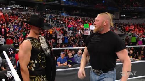 Theory y Brock Lesnar durante un segmento en WWE Raw